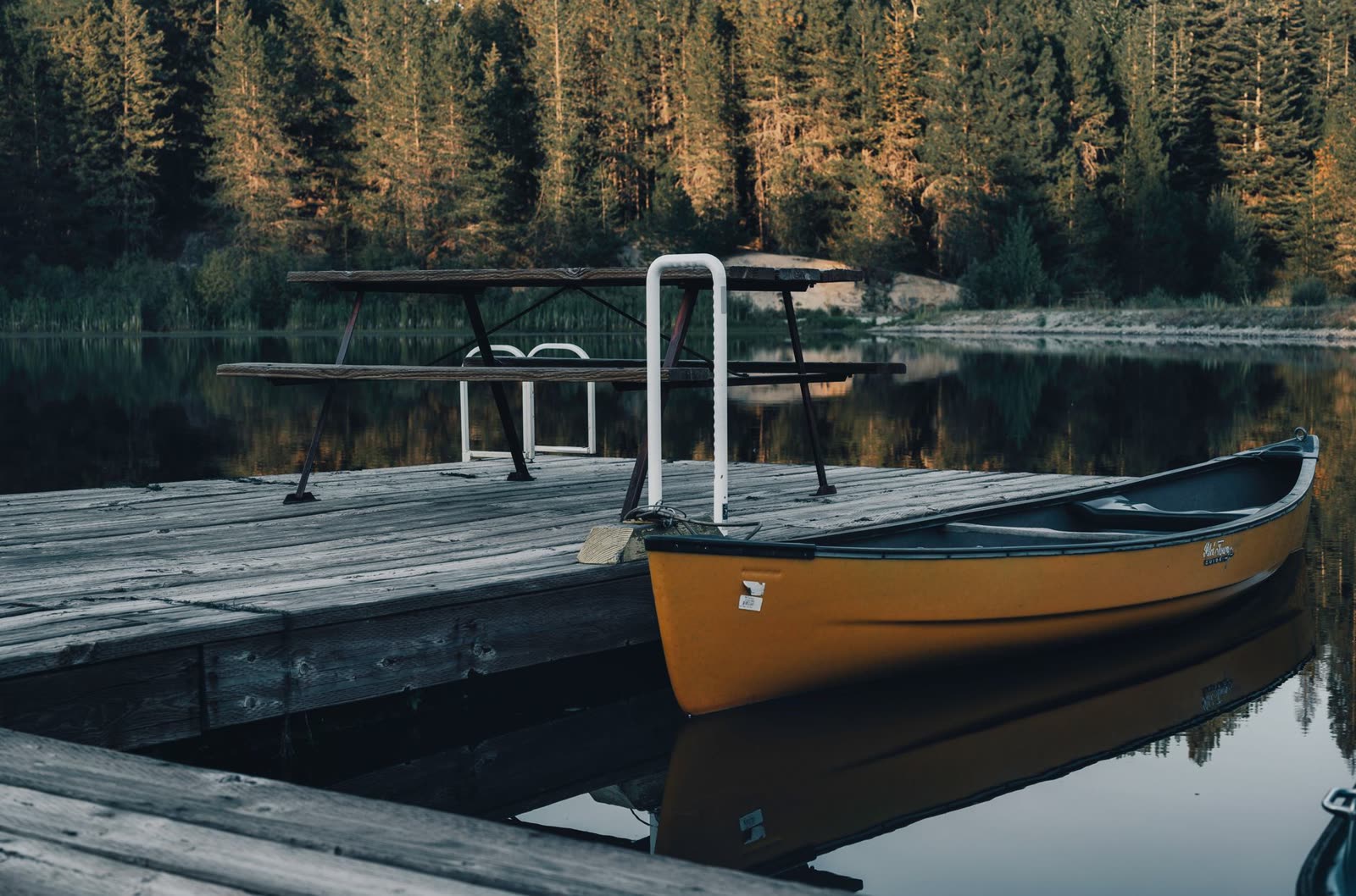 Canoe docked at a wooden pier